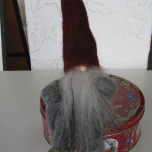 Sitting Vättetomte with red hat and sheepsking vest, movable arms and legs, wooden clogs, 14" tall, handmade by "Gnesta Tomten", Sweden