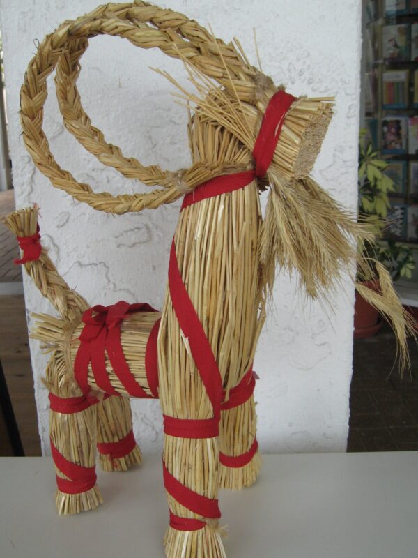 A Straw Christmas Goat, 14" tall, 11" long, made in Sweden