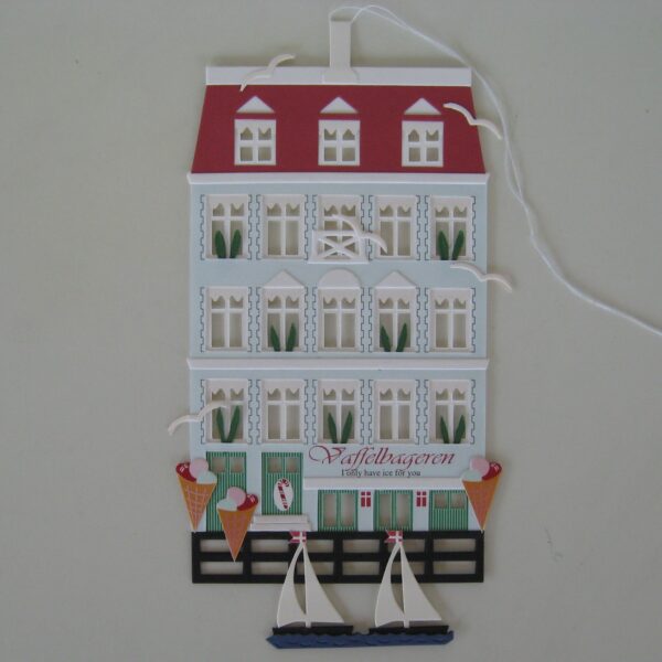 Papercut mobile "Vaffelbagaren" by Oda Wiedbrecht, 6.5" x 6.5"