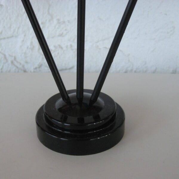 A 3-hole plastic holder for table flags