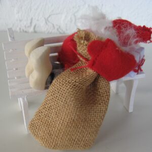 tomte sleeping on bench   6" x 4"  Made in Sweden